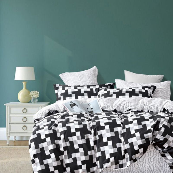 Black and white quilt cover set with checkered pattern and subtle geometric reverse, perfect for a unique style.