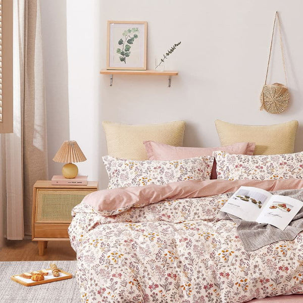  A soft pink quilt cover set featuring a delicate touch of spring, with blooms that dance softly across your bed.