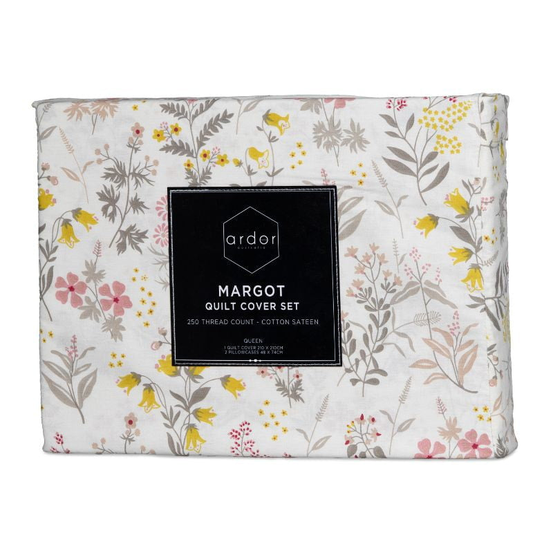 Packaging details of a soft pink quilt cover set featuring a delicate touch of spring, with blooms that dance softly across your bed.