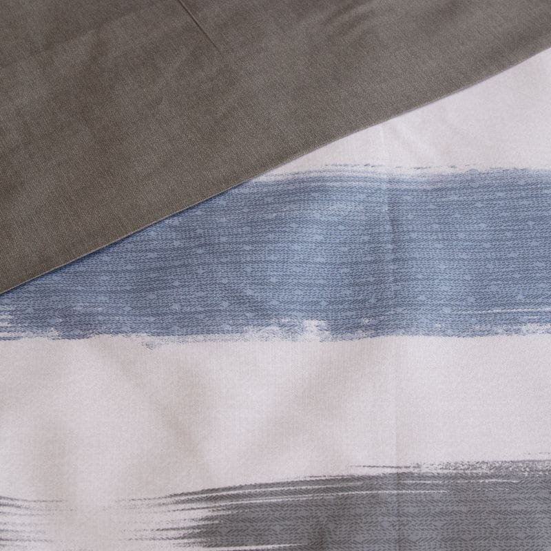 Close-up details of a Sea Breeze quilt cover set that brings the rugged beauty of the coastline to your space with its soft blue and grey colour palette and layered textures.