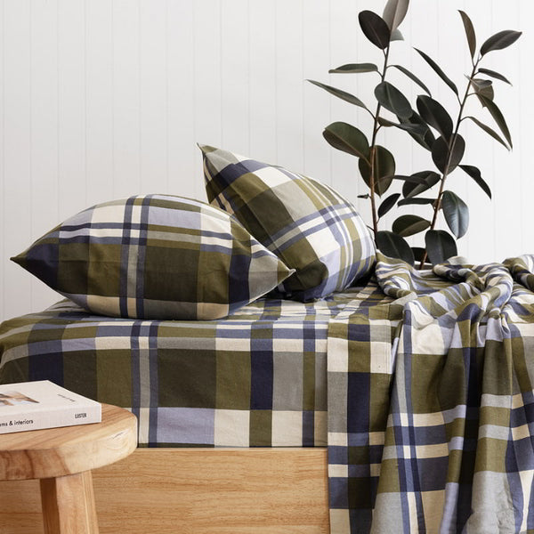 Cosy up with our soft brushed flannelette sheet set made from 100% cotton featuring a classic check pattern in black, grey, beige, and olive green.