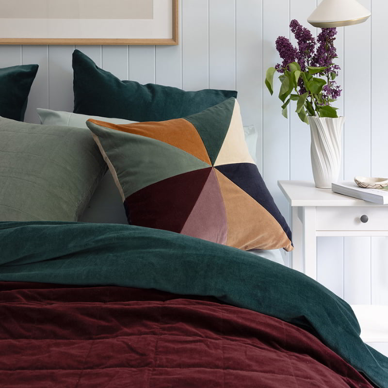 Sumptuous quilt cover set in deep teal velvet, offering elegance and comfort with plush texture, includes pillowcases, machine washable.