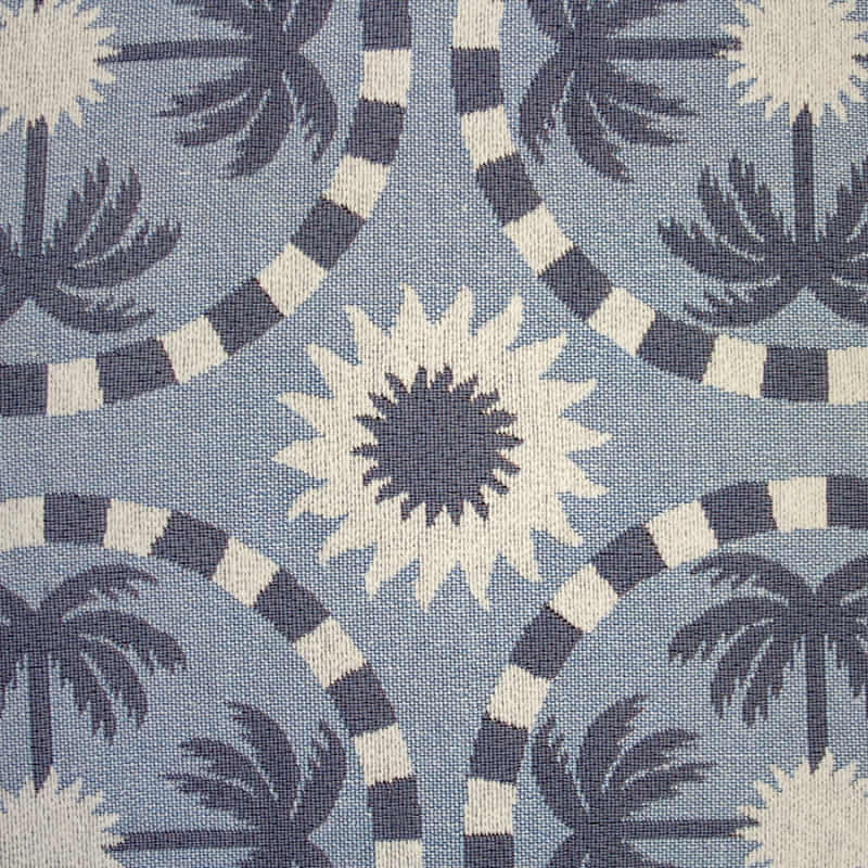 alt="close-up view of a light blue and dark blue designed with palm tree pattern bean bag"