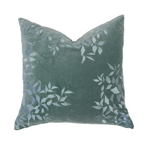 Front details of a green cushion made from luxurious cotton velvet with delicate leaf embroidery, brings nature-inspired elegance to your home.