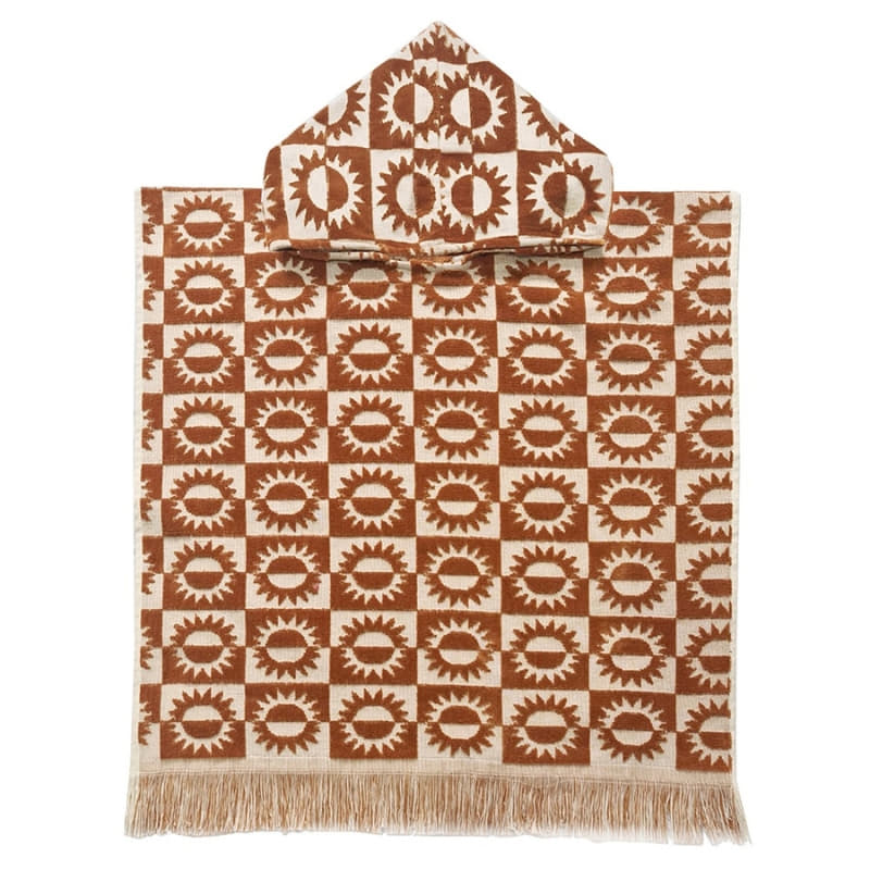 alt="Kids brown poncho featuring a stylish sun pattern with knotted tassels along the ends"