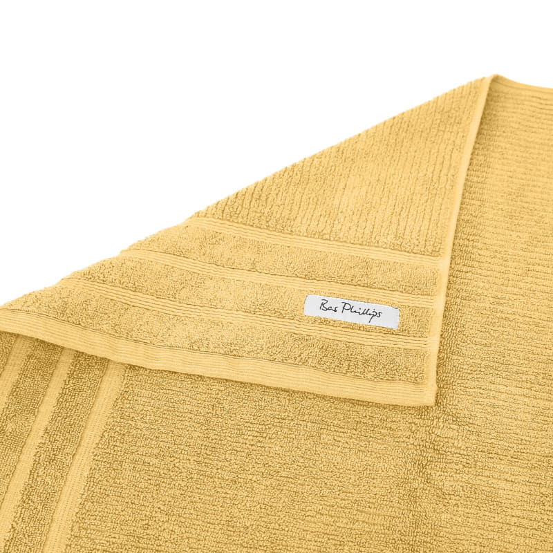 alt="Zoom in edge details of sunshine Bath towel featuring its finest Egyptian cotton and high level of softness."