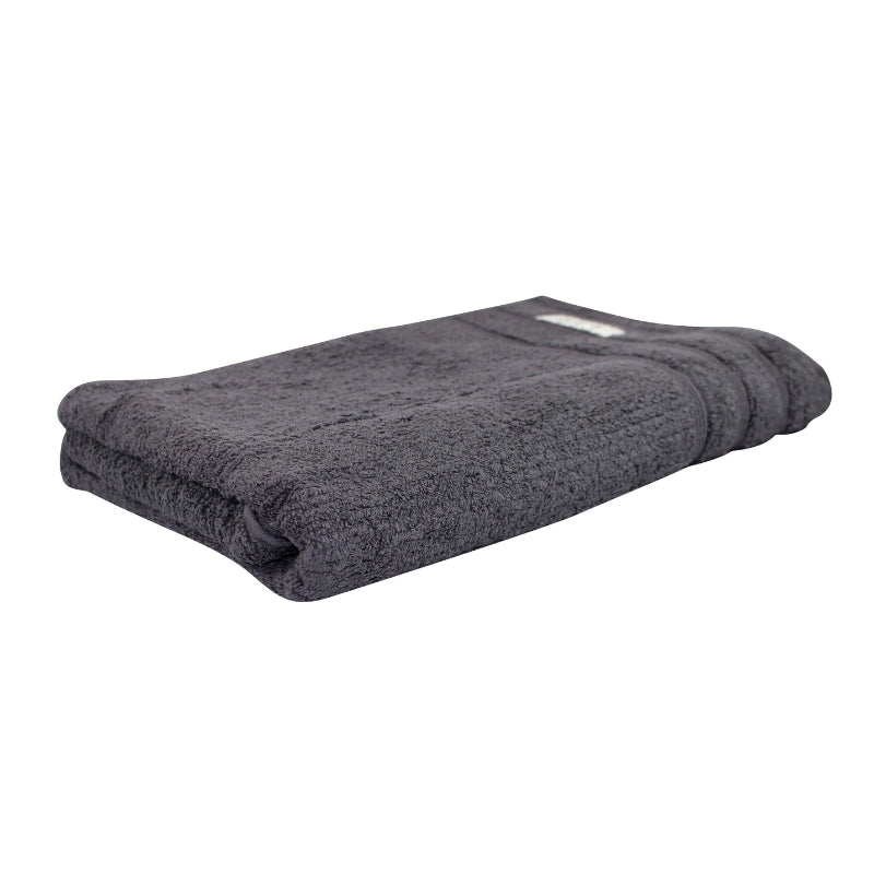 alt="Actual folded details of graphite bath towel featuring its finest egyptian cotton and high level of softness."