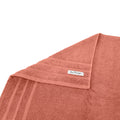 alt="A folded details of cairo egyptian cotton face washer in rose colour featuring its minimal and soft details"