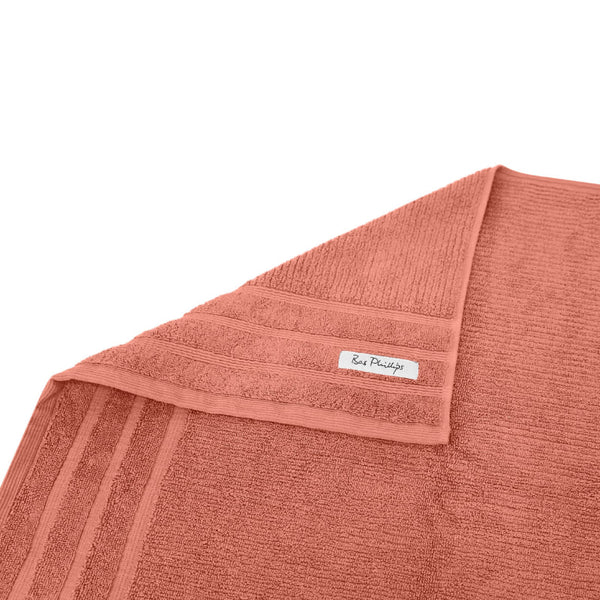 alt="A folded details of cairo egyptian cotton face washer in rose colour featuring its minimal and soft details"