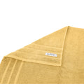 alt="A folded details of cairo egyptian cotton face washer in yellow colour featuring its minimal and soft details"