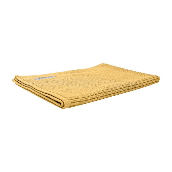 Yellow egyptian bath mat showcasing a delightful design in intricate detail.