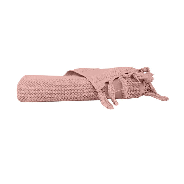 alt="An elegantly folded premium pink hand towel, showcasing its minimal and side details"