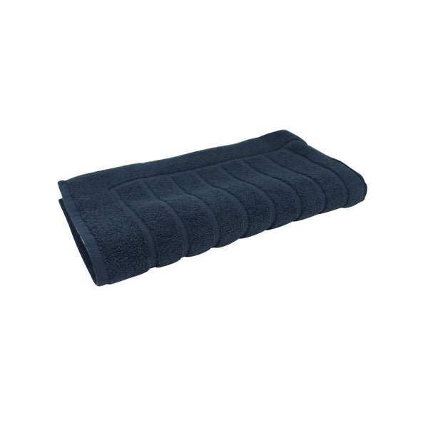 alt="The Nautical Navy Valencia Zero Twist bath mat unveils intricate folded details, adding a luxurious touch to your bathroom"