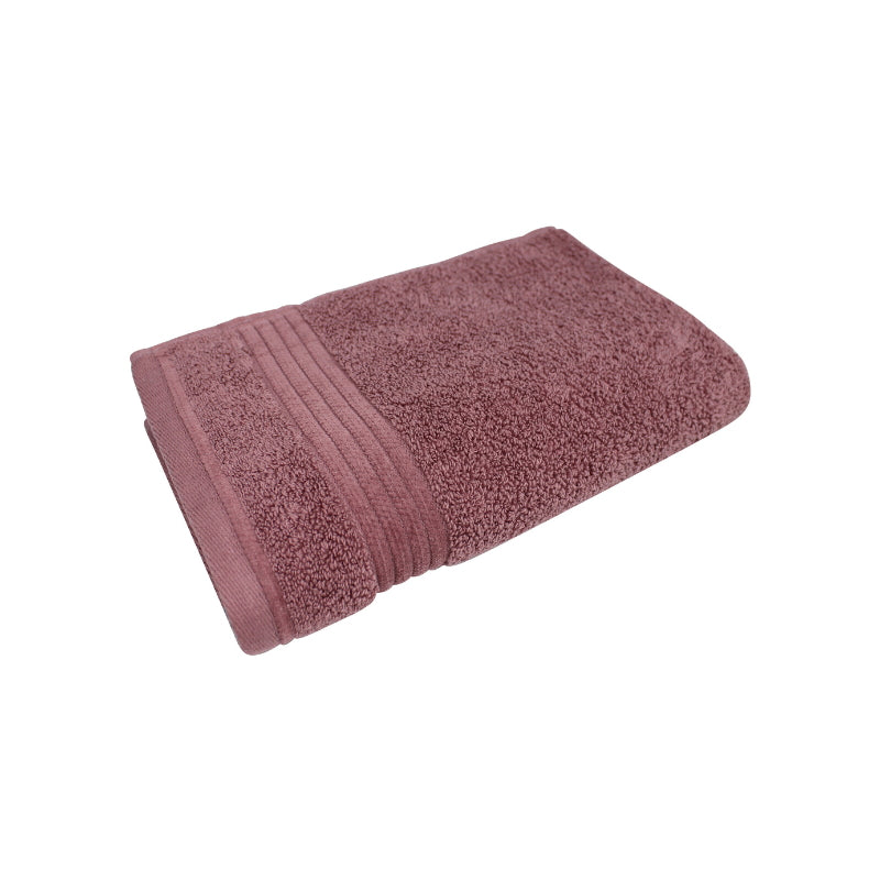 alt="Close-up image of a premium pink hand towel, showcasing details and high-quality craftsmanship in the front view."