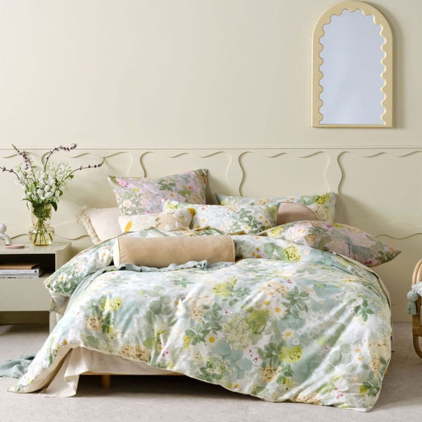 "A photographic floral motif quilt cover set in a comfy bedroom"