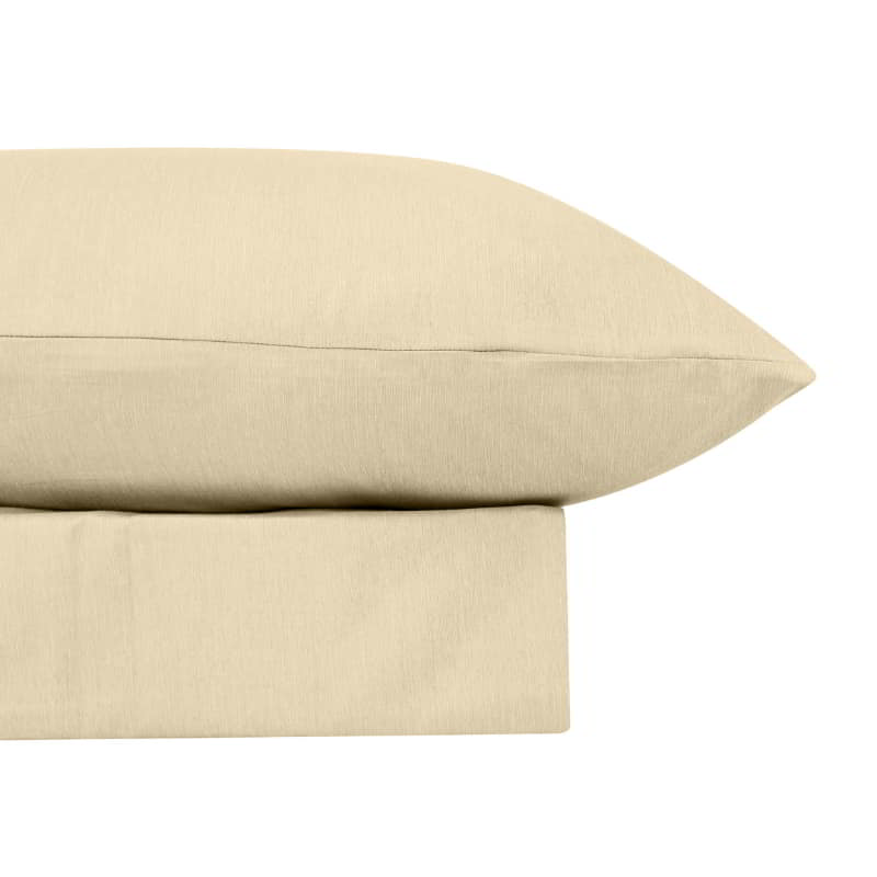 alt="Close-up look of a luxuriously soft to touch bamboo and microfibre blend sheet set in cream"
