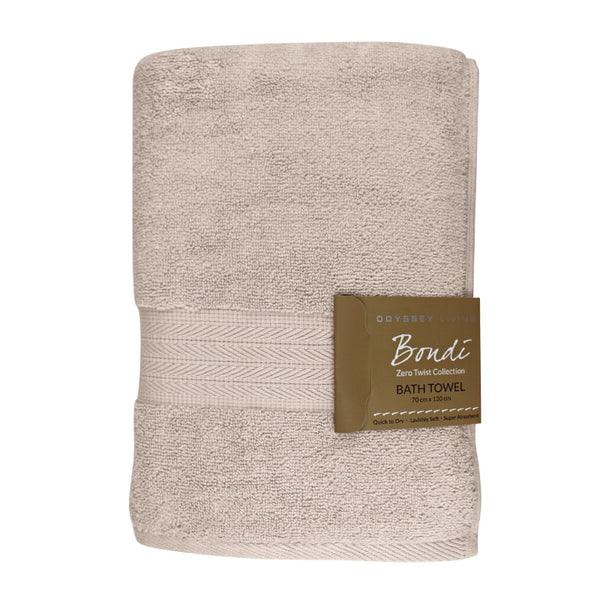 alt="A folded with tag details of beach bath towel featuring its high level of softness and premium luxurious cotton."
