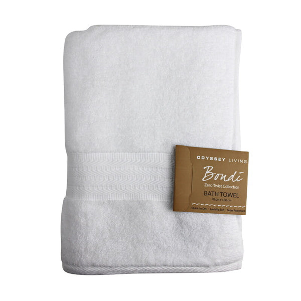 alt="A folded with tag details of white bath towel featuring its high level of softness and premium luxurious cotton."