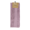 alt="A neatly folded, premium mauve mist hand towel hanging on a hook, showcasing its minimalistic design and inviting softness."
