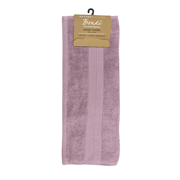 alt="A neatly folded, premium mauve mist hand towel hanging on a hook, showcasing its minimalistic design and inviting softness."