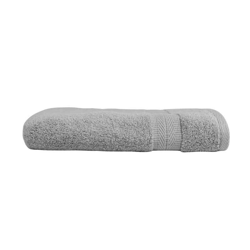 alt="An elegantly folded premium silver oasis hand towel, showcasing its minimal and soft details"
