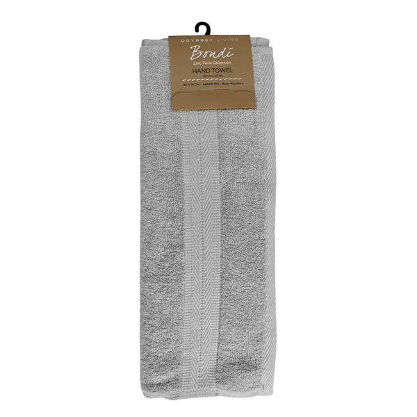 alt="A neatly folded, premium silver oasis hand towel, showcasing its minimalistic design and inviting softness."
