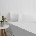 alt="A stunning White breath cotton sheet set in a bedroom setup"