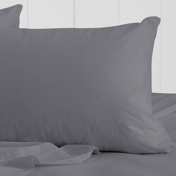 alt="The actual photo of a breath cotton standard pillowcase in charcoal colour featuring its minimal, inviting softness and comfort" 