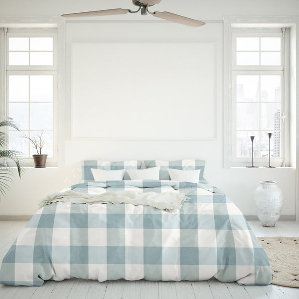 Serene bedroom with blue/white checkered comforter set of Chelsea Sunwashed Comforter Set, infusing elegance and tranquillity into the sleeping area.