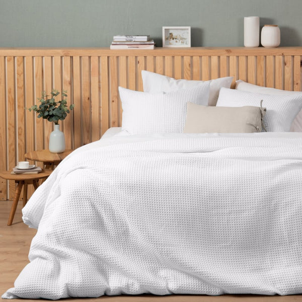 Luxurious quilt cover set in a white colour scheme featuring a modern texture.