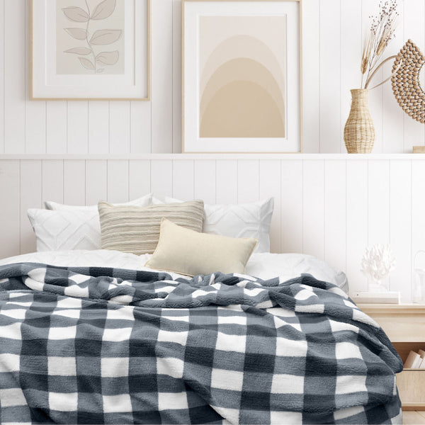 Get an amazing experience with our charcoal and white blanket featuring a large checkered pattern creates a bold visual grid, adding colour and pattern to the room's decor.