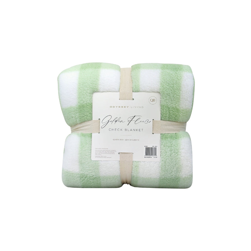 Back packaging details of a cosy bed with a green and white blanket featuring a large checkered pattern creates a bold visual grid, adding colour and pattern to the room's decor.