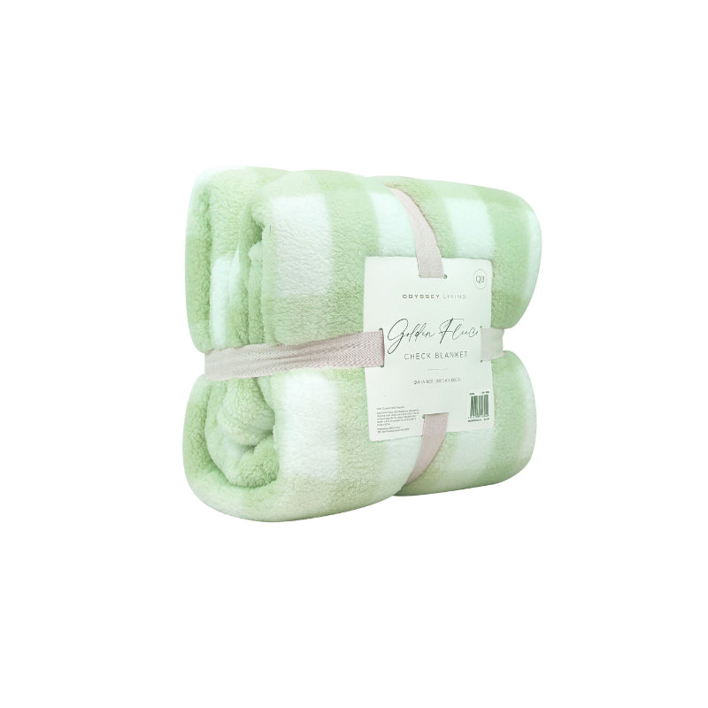 Side packaging details of a cosy bed with a green and white blanket featuring a large checkered pattern creates a bold visual grid, adding colour and pattern to the room's decor.