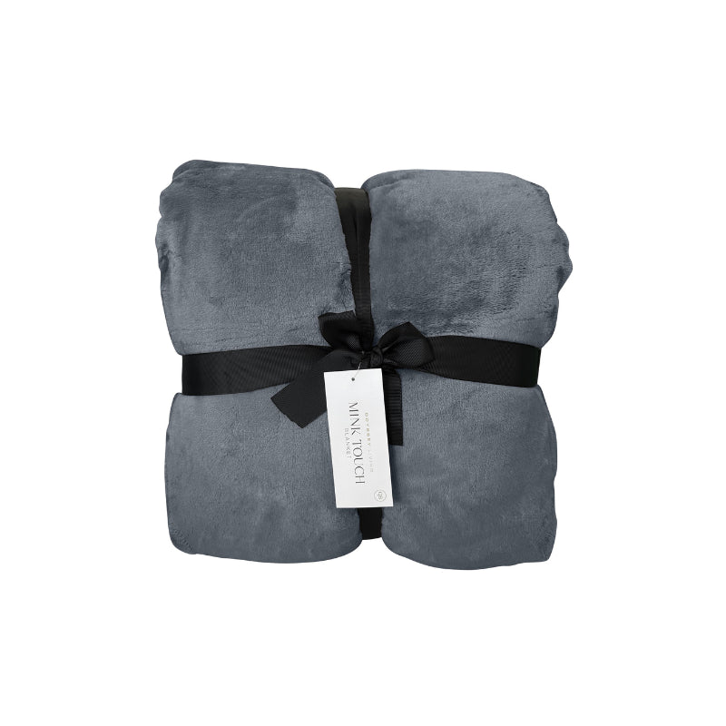 Front packaging details of a luxurious mink touch blanket in a shade of graphite featuring minimalist design, soft, velvety texture for cosy warmth.