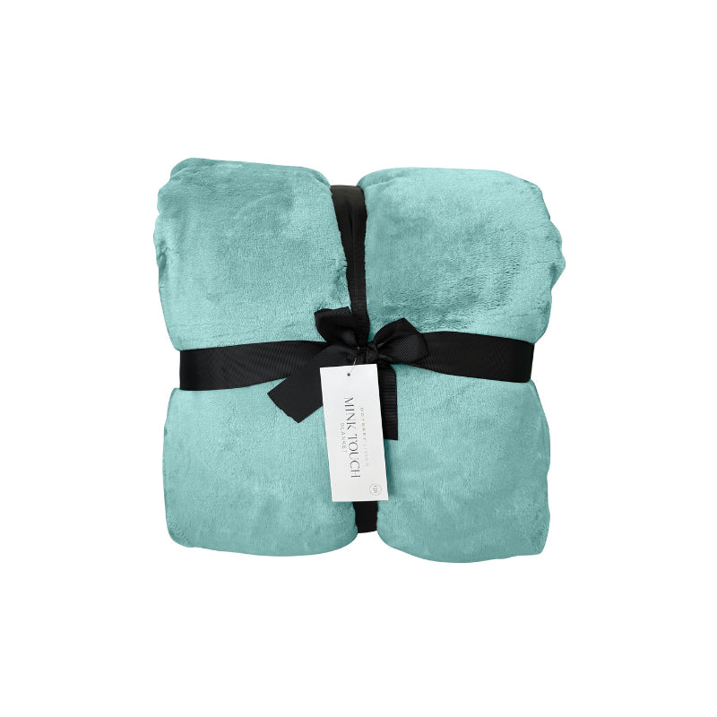 Front packaging details of a luxurious mink touch blanket in a shade of jade mist featuring minimalist design, soft, velvety texture for cosy warmth. 