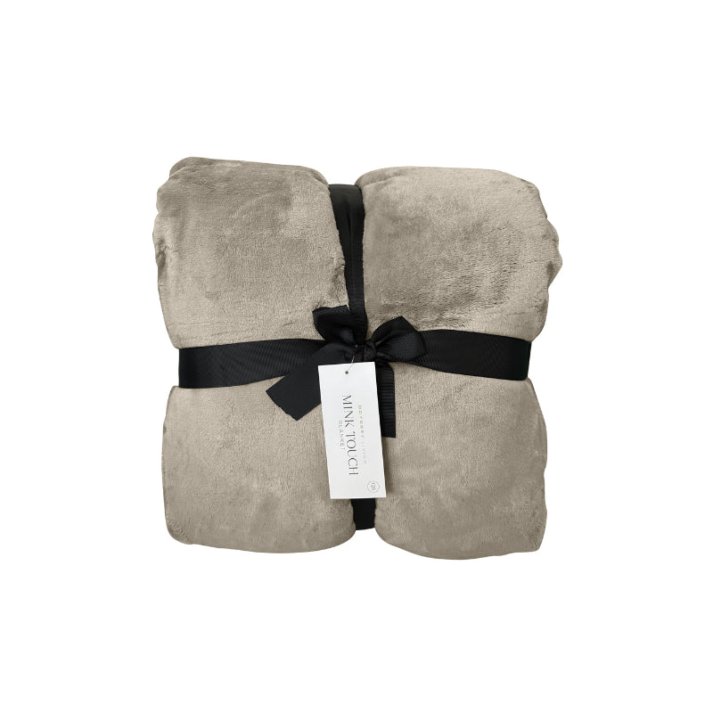 Front packaging details of a luxurious mink touch blanket in a shade of stone featuring minimalist design, soft, velvety texture for cosy warmth. 