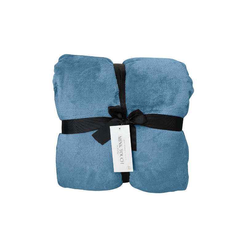 Front packaging details of a luxurious storm blue mink-touch blanket featuring a minimalist design and a soft, velvety texture for cosy warmth.