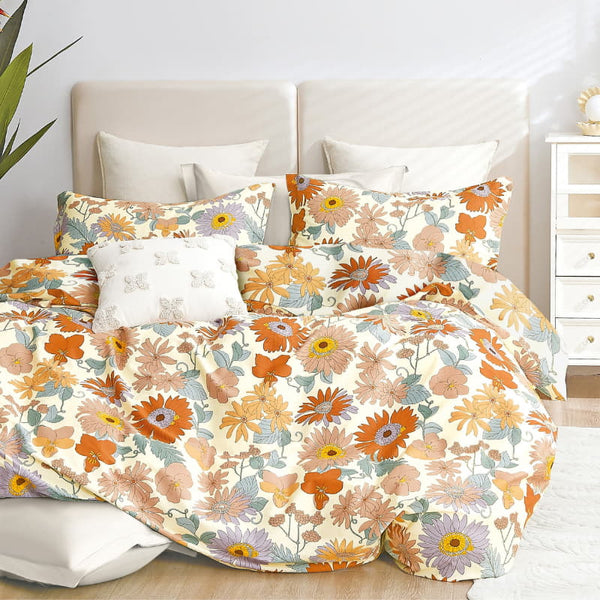 alt="The luxurious quilt cover set features statement flowers, creating a fresh modern."