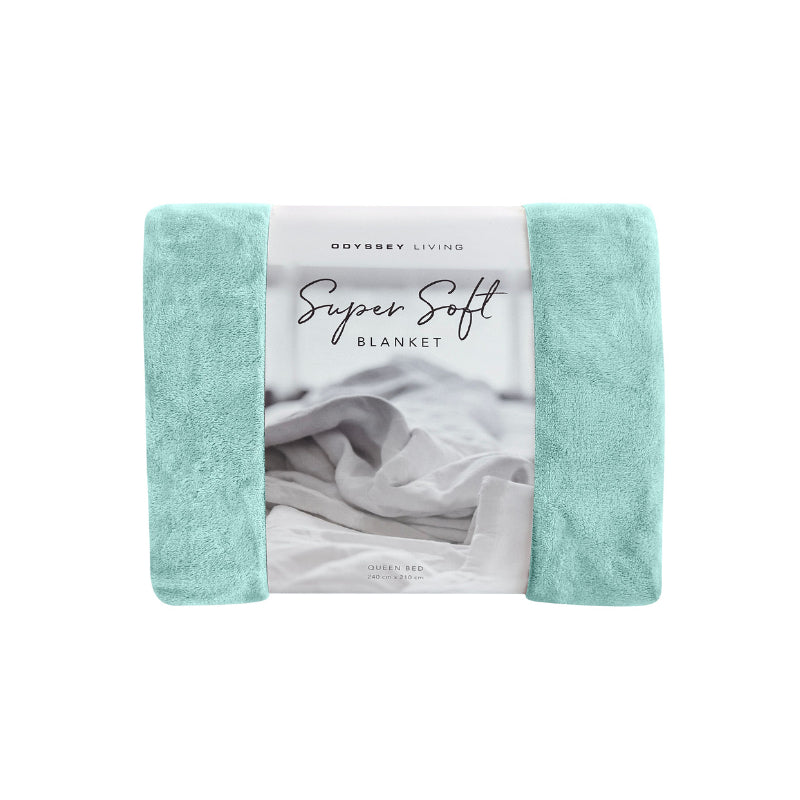 Front details of the blue Odyssey Living Super Soft Blanket creating the perfect setting to cosy up in the luxurious comfort and warmth of the bed.