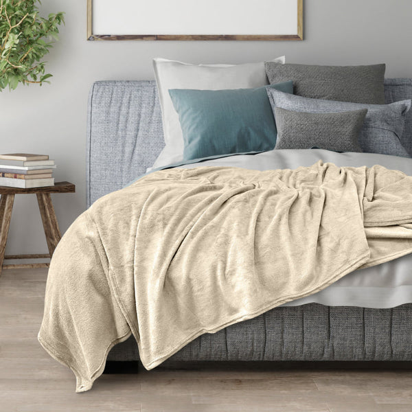 Transform your space into a cosy sanctuary with the cream Odyssey Living Super Soft Blanket, designed to complement your mood and décor with its harmonious colour scheme.