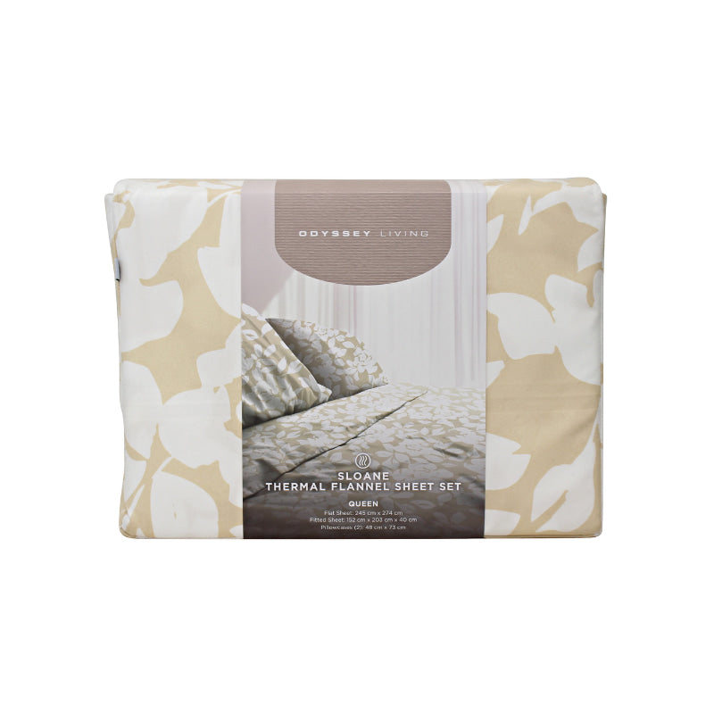 Front packaging details of a blue bed sheets and pillows, adorned with a monochromatic white floral and foliage pattern, craft a serene and unique design.