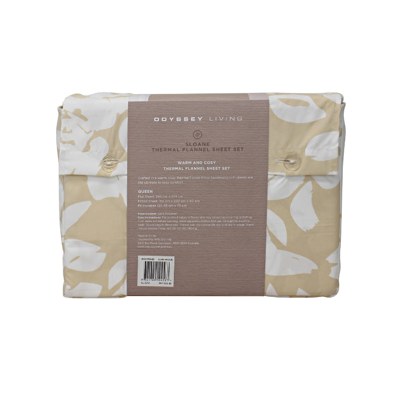 Back packaging details of a natural-toned bed sheets and pillows, adorned with a monochromatic white floral and foliage pattern, craft a serene and unique design.