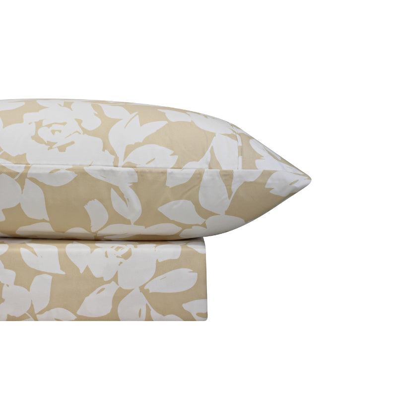 A natural-toned bed sheets and pillowcase, adorned with a monochromatic white floral and foliage pattern, craft a serene and unique design.