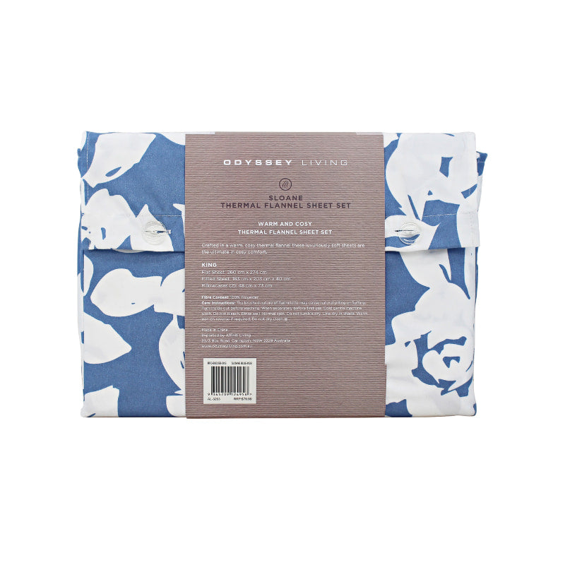  Back packaging details of a blue bed sheets and pillows, adorned with a monochromatic white floral and foliage pattern, craft a serene and unique design.