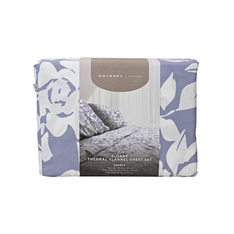 Front packaging details of a lavender-toned bed sheets and pillows, adorned with a monochromatic white floral and foliage pattern, craft a serene and unique design.