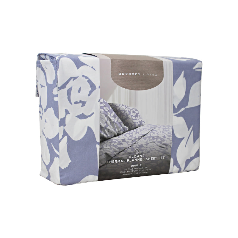 Side packaging details of a lavender-toned bed sheets and pillows, adorned with a monochromatic white floral and foliage pattern, craft a serene and unique design.