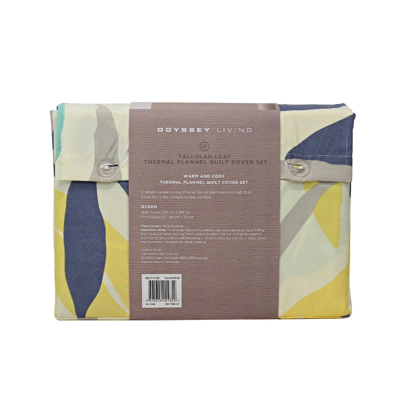 Back packaging details of a modern bedroom with a blue and yellow bedspread, featuring a botanical leaf pattern in soft tones, perfect for warmth and comfort.
