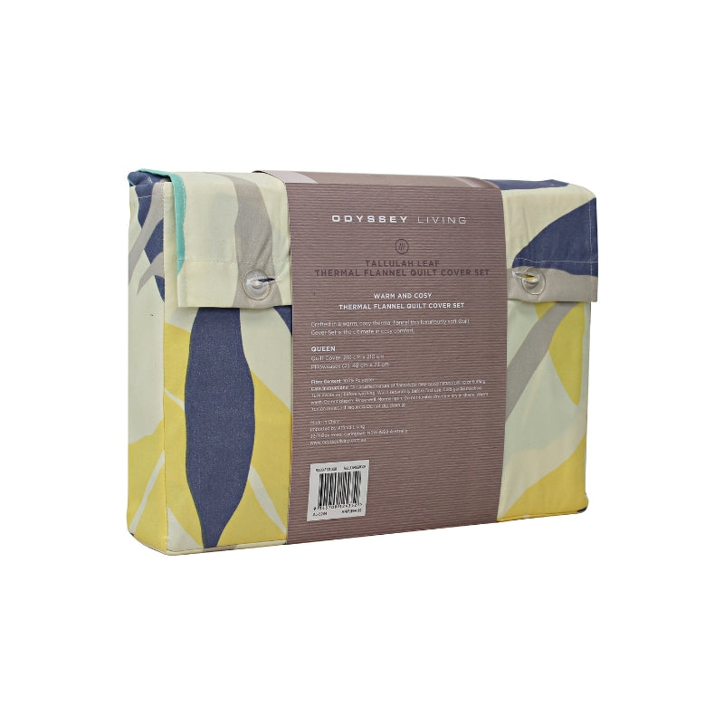 Side packaging details of a modern bedroom with a blue and yellow bedspread, featuring a botanical leaf pattern in soft tones, perfect for warmth and comfort.