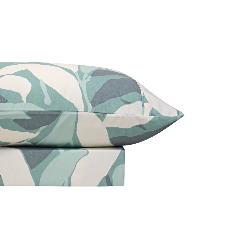 A cosy bed sheet set and pillowcase with a teal and white sheet set from Odyssey Living, featuring a modern abstract pattern in teal and white tones.