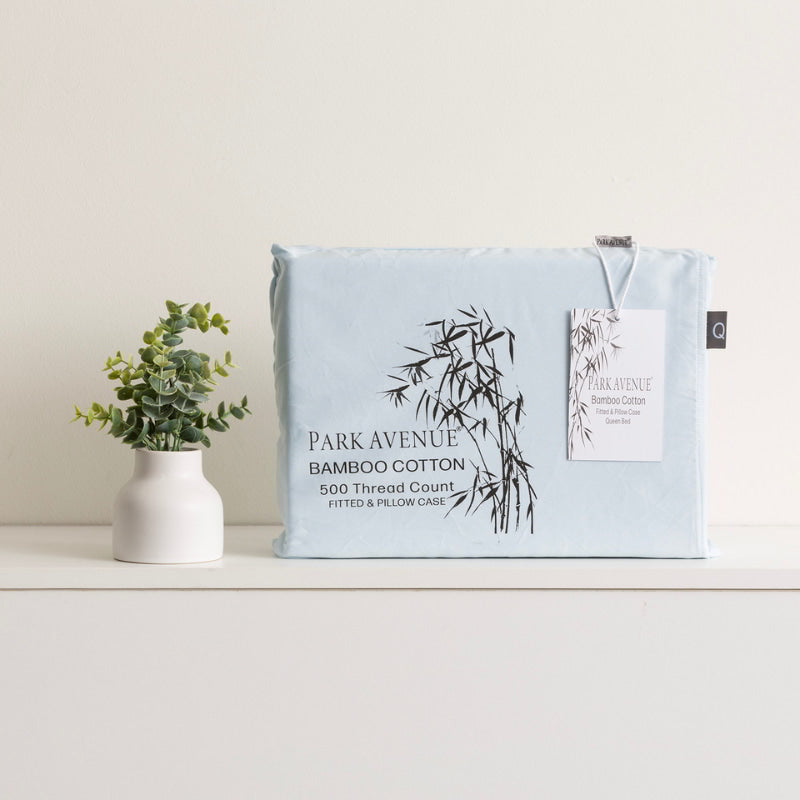 alt="Bamboo cotton fitted and pillowcase packaging on white shelf. Soft, breathable, and silky smooth combo set with 50% bamboo and 50% cotton fibres."